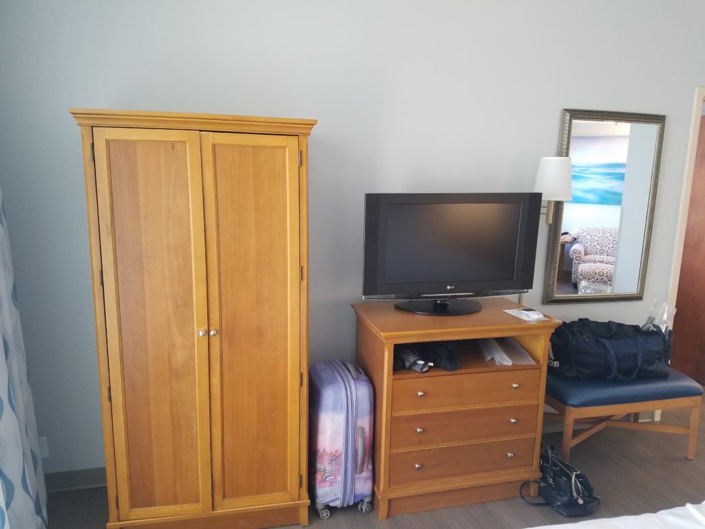 Holiday Inn Resort Wrightsville bedroom cabinets and TV